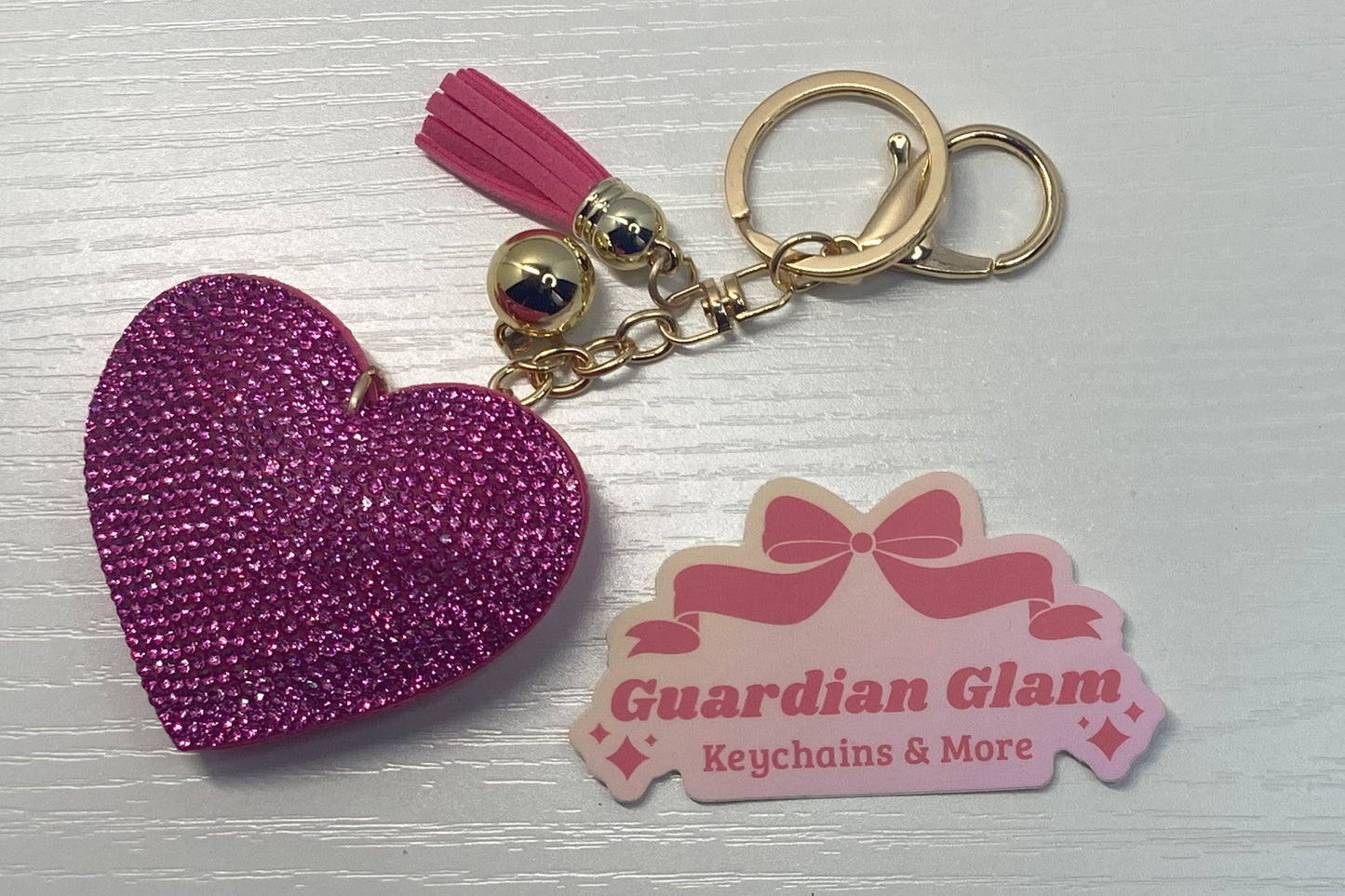 Dark Pink Heart-shaped rhinestone  
Gold keychain with tassel