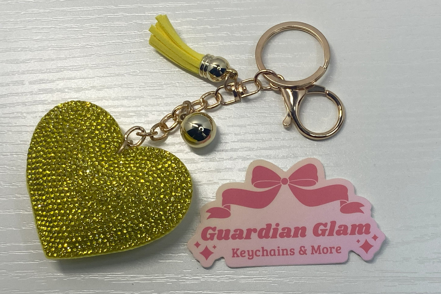 Yellow Heart-shaped rhinestone
 Gold keychain with tassel