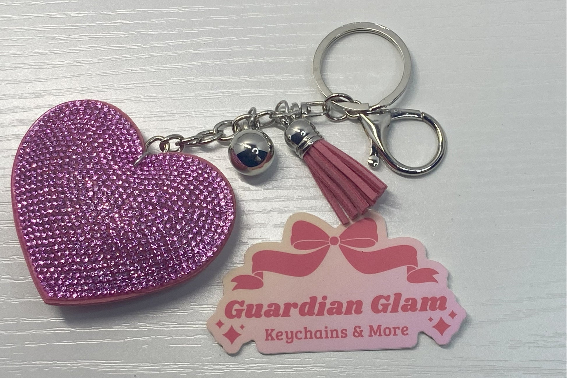 Light Pink Heart-shaped rhinestone 
Sliver keychain with tassel