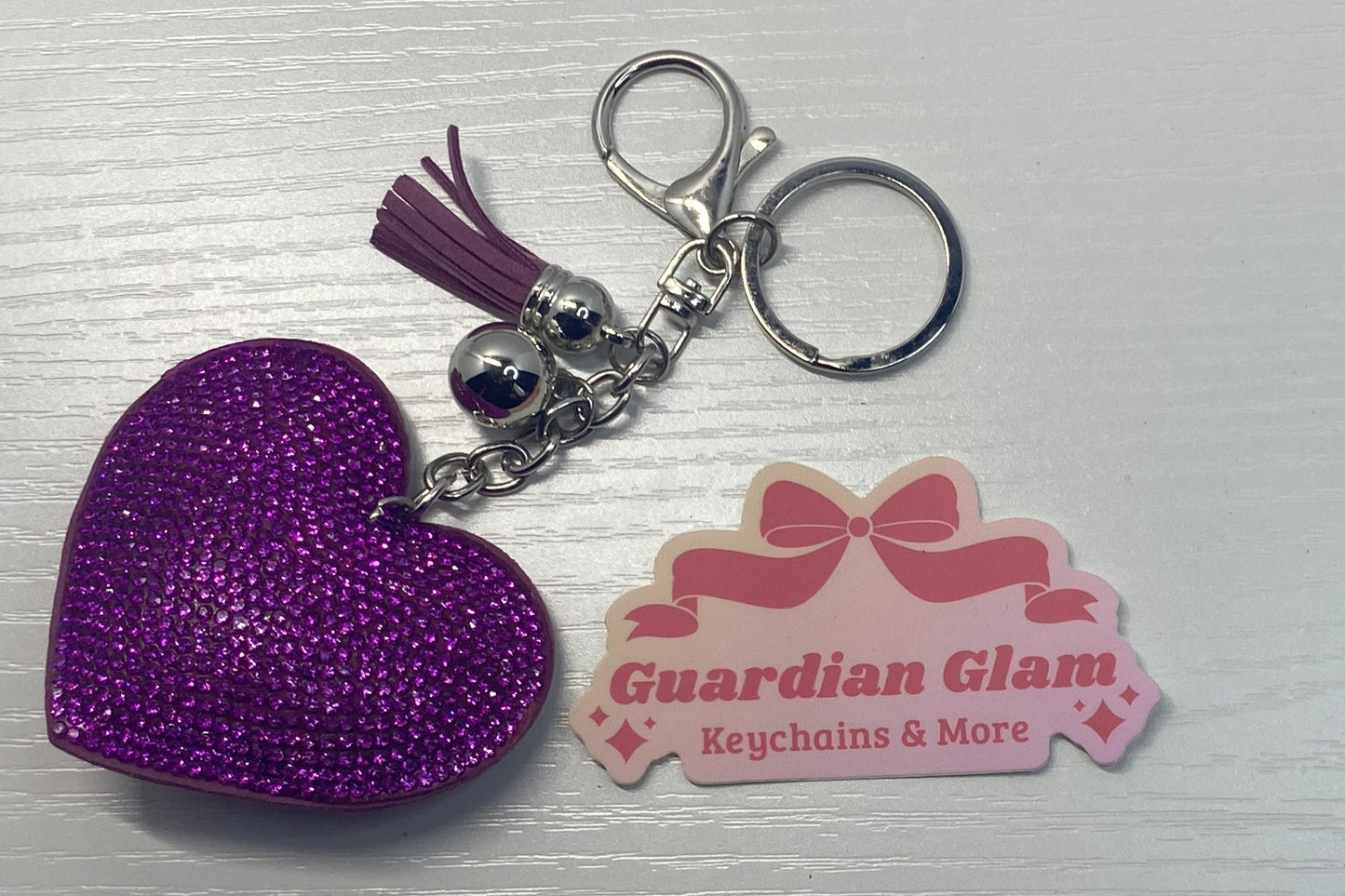 Purple heart-shaped rhinestone
sliver keychain with tassel