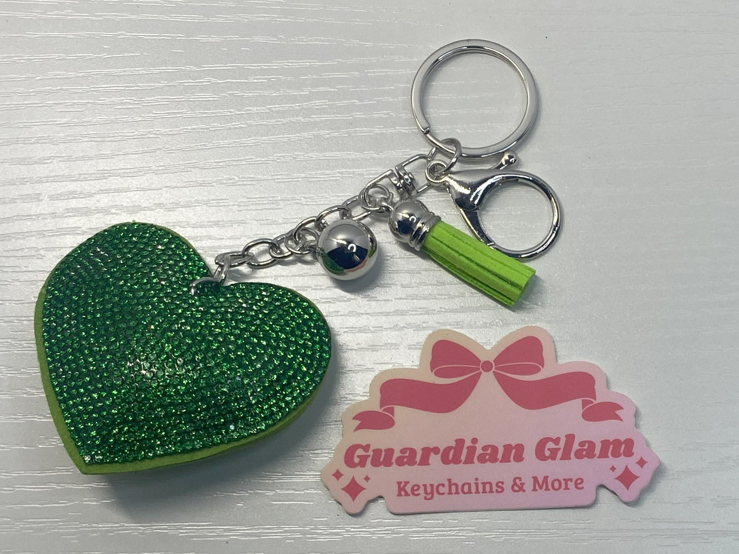 Green Heart-shaped rhinestone  
Sliver keychain with tassel