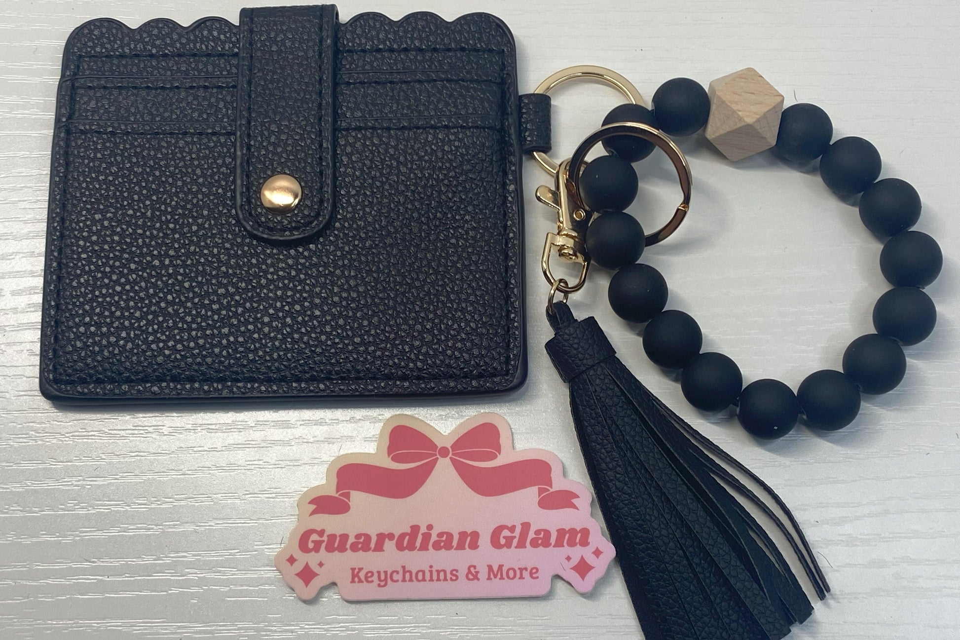 Black leather ID and cardholder, black wood beaded keychain with tassel