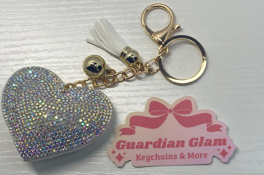 White Heart-shaped rhinestone 
Gold keychain with tassel